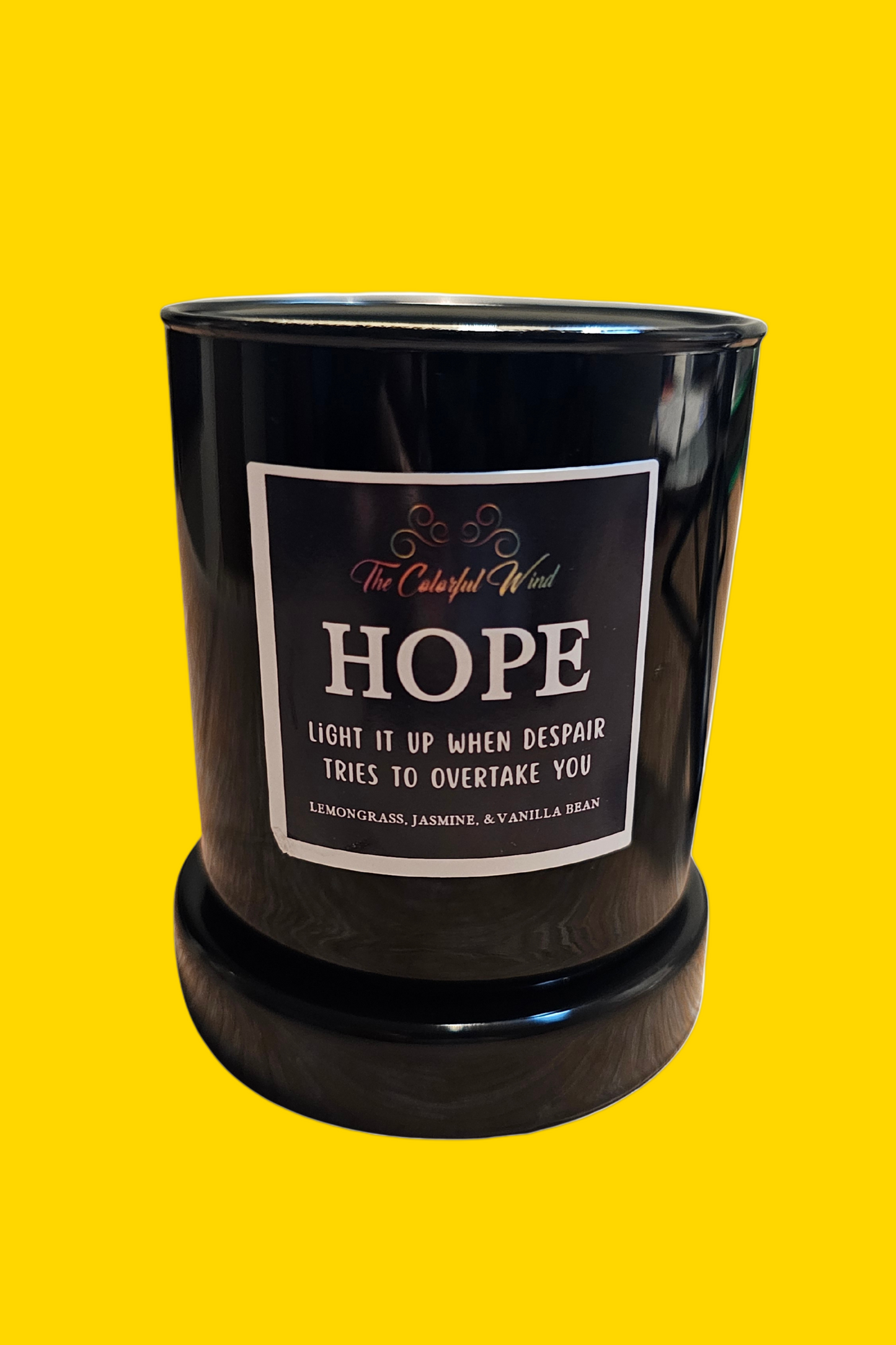 Black candle with a label on a white background