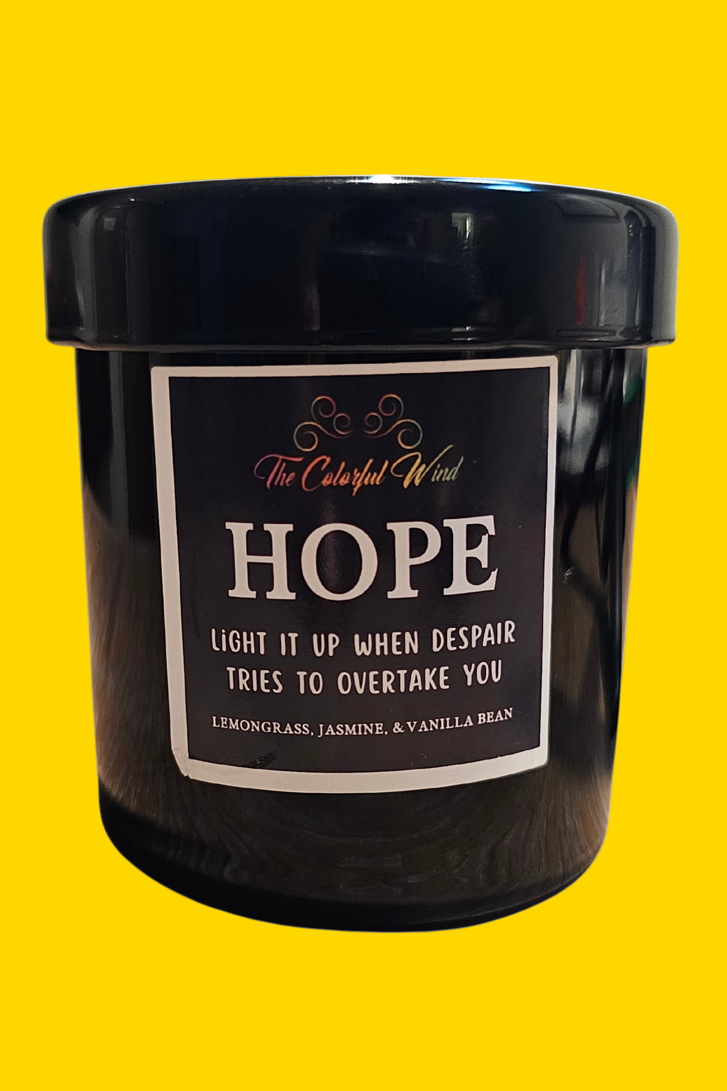 Black candle with a label on a white background