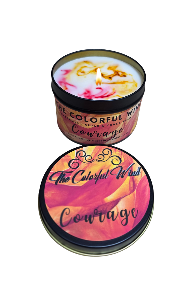 Candle in a tin with 'Courage' text on a white background